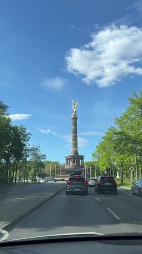 Vehicle passenger photographs Berlin's Victory Column monument
