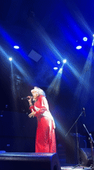 Live vocal performance on a smoke-filled stage in Barranco