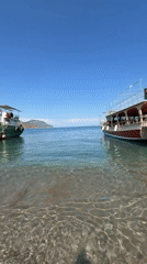 Two boats anchored in turquoise waters near Kumluca, Turkey