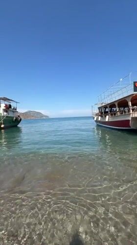 Two boats anchored in turquoise waters near Kumluca, Turkey