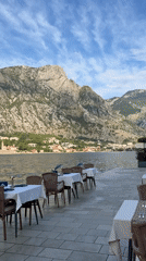 Kotor's waterfront: dining, statues, and mountain views