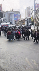 Adults march in demonstration on La Paz street