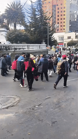 Adults march in demonstration on La Paz street