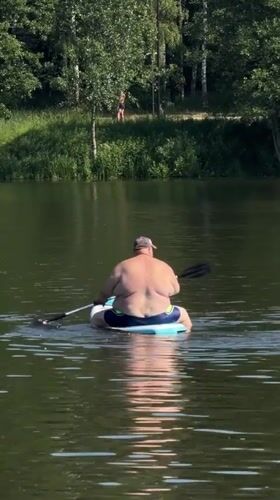Morning lake recreation captured in Malakhovka, Russia