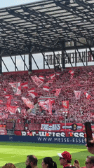 Red and white soccer fans pack Essen stadium stands