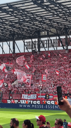 Red and white soccer fans pack Essen stadium stands