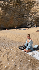 Beachgoers gather on sandy shores in Budva, Montenegro