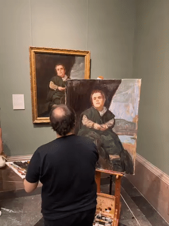 Visitor documents extensive art collection during Prado Museum afternoon tour