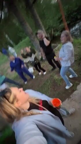 Group enjoys outdoor picnic with dancing near Markovo water