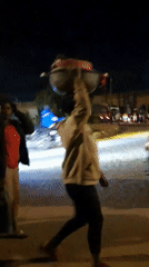 Night market activity and cattle movement through Bukuru streets