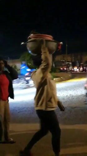 Night market activity and cattle movement through Bukuru streets