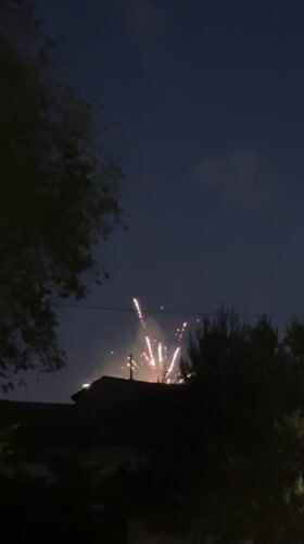 Evening scenes and fireworks in Blagoveshchensk with illuminated bridge