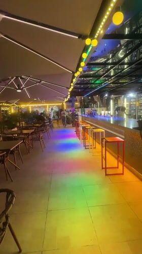 Sea Rock Coffee glows at night on the Qinhuangdao waterfront