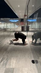 Man performs late-night handstand exercise in Puebla, Mexico