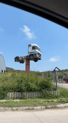 Road trip through geological park with unusual truck landmark