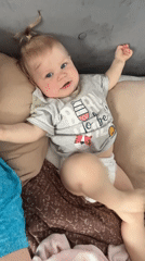 Mother and baby share quiet moments in Vesyoloye home