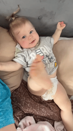 Mother and baby share quiet moments in Vesyoloye home
