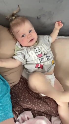 Mother and baby share quiet moments in Vesyoloye home