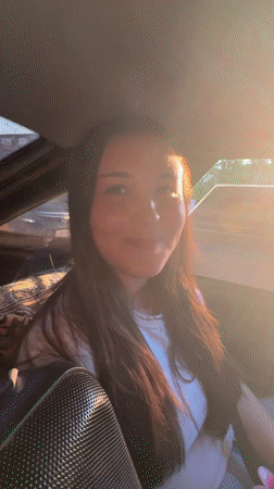 Young women share playful moments during car ride in Perm