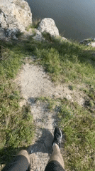 Hiker reaches cliff overlook near Serga, Russia