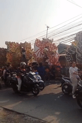 Ornate cultural parade floats move through Karawang streets
