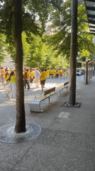 Colombian flag-bearers in yellow march through downtown Vancouver