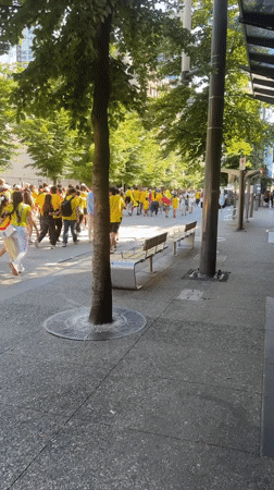 Colombian flag-bearers in yellow march through downtown Vancouver