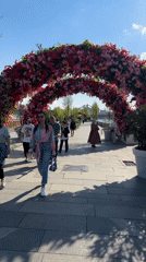 Pedestrians visit Moscow monuments during sunny afternoon stroll