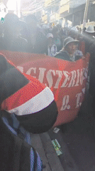 Demonstrators march with MAGISTERIO banner in street protest