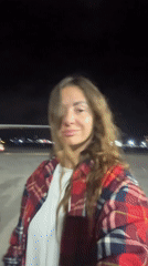 Woman photographed near aircraft at night in Kuta