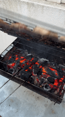 Mixed grill over hot coals in Almada on a summer evening