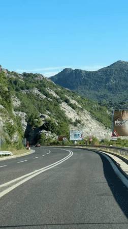 Mountain road documented in Montenegro on sunny morning