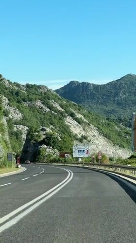 Mountain road documented in Montenegro on sunny morning