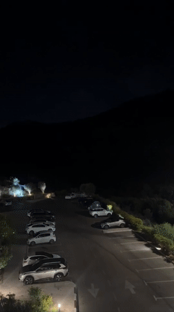 Nighttime parking lot scene in Tirat Karmel, Israel