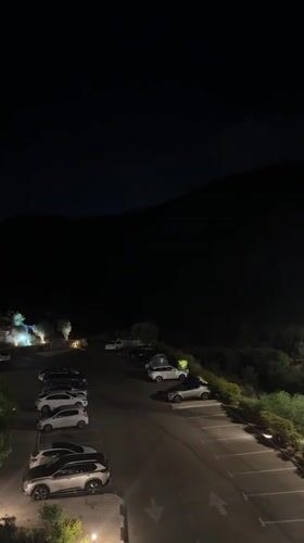 Nighttime parking lot scene in Tirat Karmel, Israel