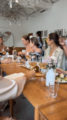 Women's dining gathering captured at Ubud restaurant with desserts
