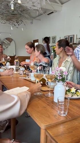 Women's dining gathering captured at Ubud restaurant with desserts