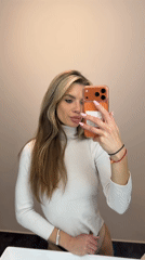 Woman takes selfies on Berlin street near construction