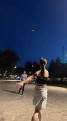 Casual badminton game in a Krasnogorsk park at dusk