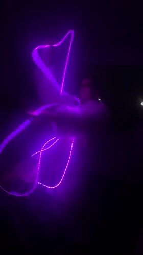 Late-night light ribbon dance performance captured in Mexico City