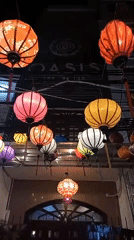 Colorful lanterns illuminate nighttime street scene in Nha Trang