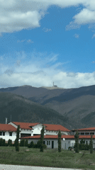 Road journey documented through Bulgarian towns with red-roofed buildings