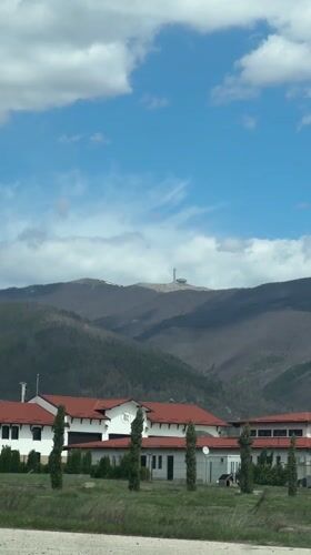 Road journey documented through Bulgarian towns with red-roofed buildings