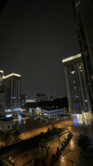 Rainy Night Cityscape Documented from High-Rise Vantage Point