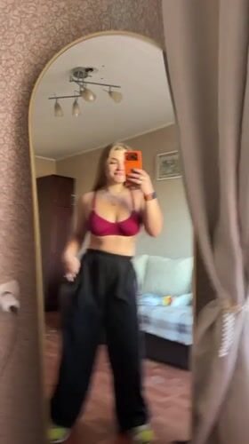 Woman documents mirror selfie session in Russian apartment