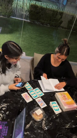 Young women socialize over food in Mexican patio gathering