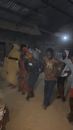 Evening dance gathering in a rustic Gudi, Nigeria venue