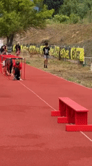 Children train on athletic track in Kazanlak, Bulgaria