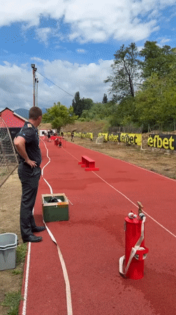 Children train on athletic track in Kazanlak, Bulgaria