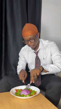 Man enjoys lunch break in Joma, Ghana